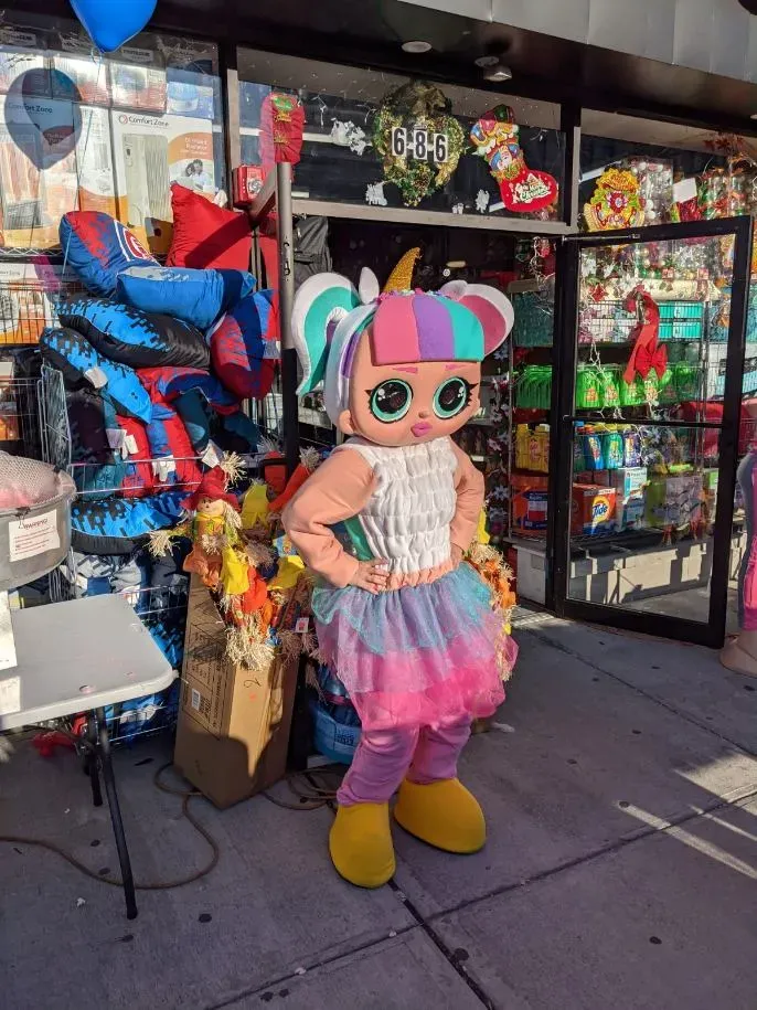Colorful costumed characters posing at a celebration