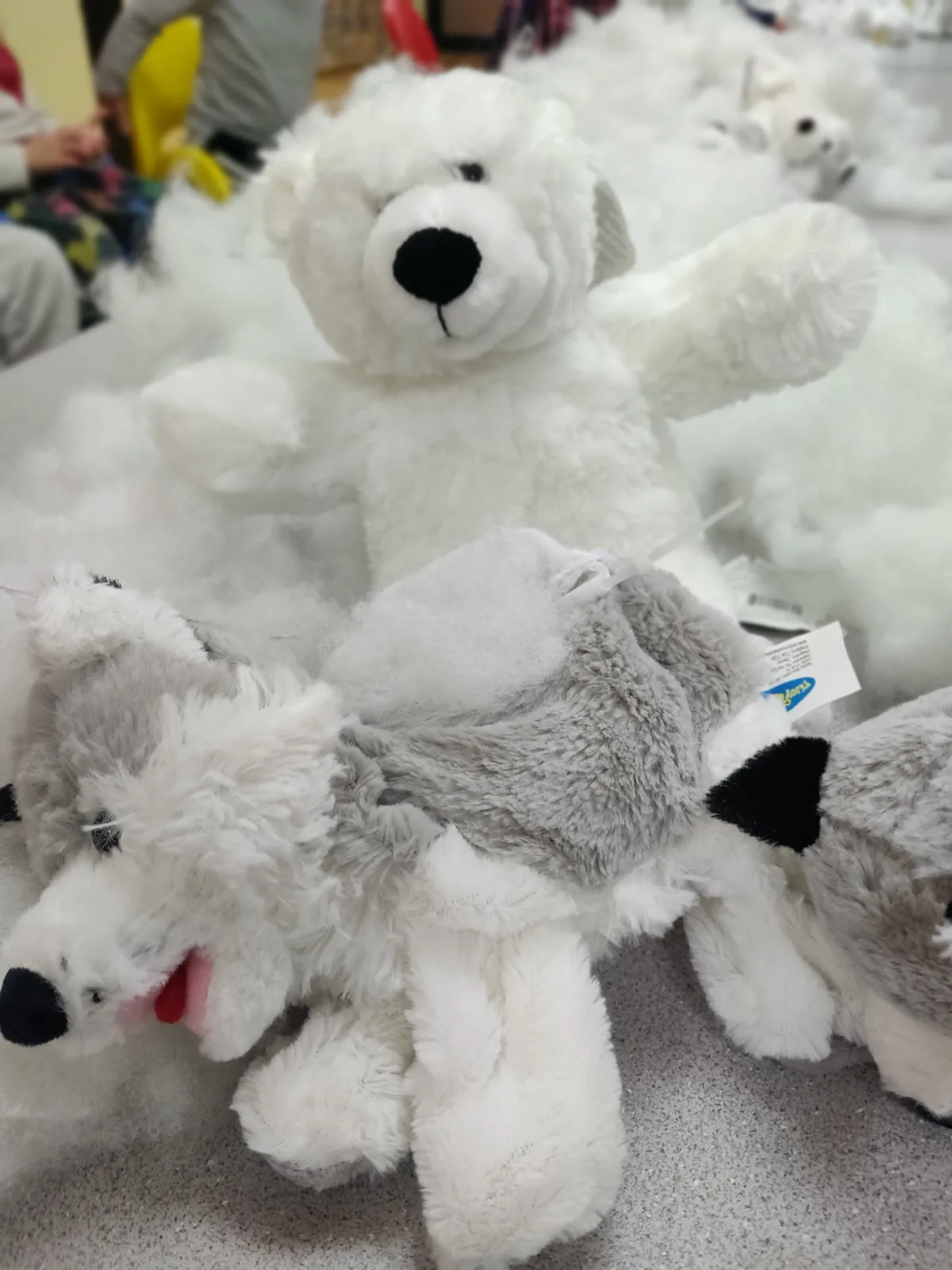 White polar bear plush toys among loose stuffing